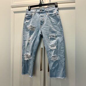 Levi's 501 Light Blue Distressed Straight Leg Jeans. Cropped.